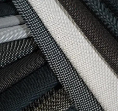 Close-up of motorized patio screen mesh fabric material options